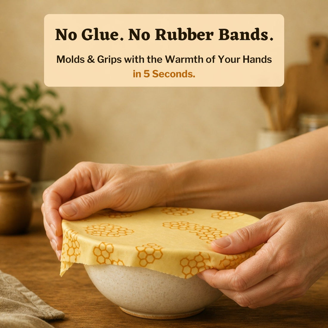 Hands warming and shaping an Everloaf beeswax wrap over a ceramic bowl